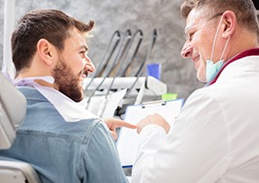 Dentist in Lincoln examining patient during emergency dental visit