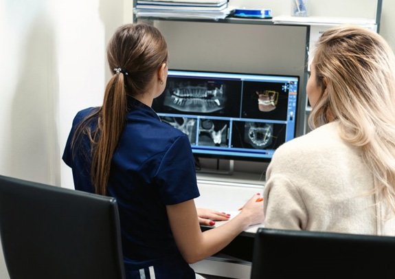 a dentist using 3 D dental imagery 