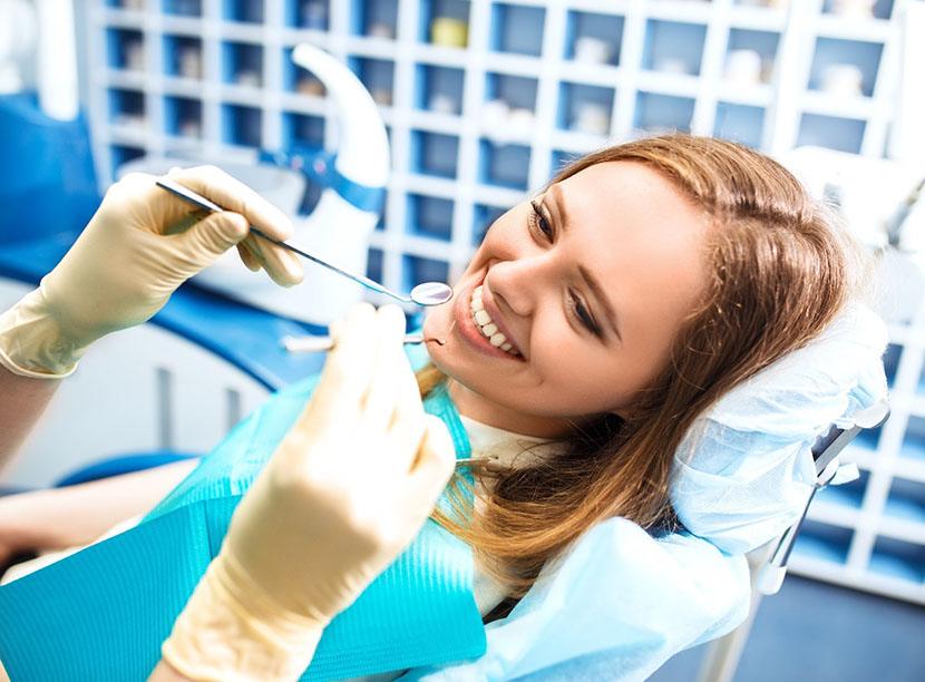 Woman receiving dental bonding in Lincoln