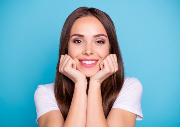 Woman showing off flawless smile after makeover