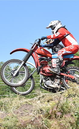 Doctor Parks standing beside a dirt bike