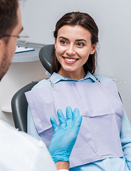 Dentist and patient talking about dentistry services during dental visit