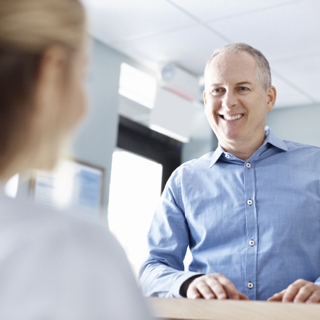 Patient discussing dental insurance with team member