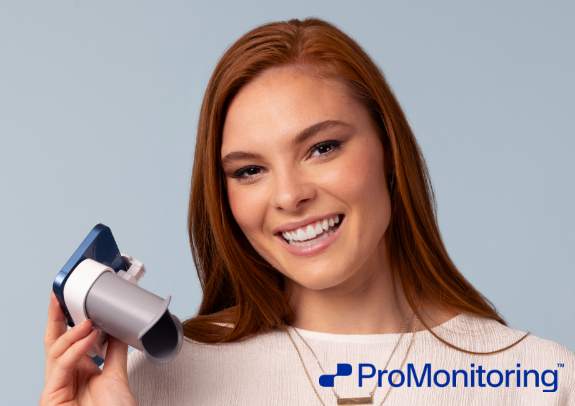 Lady Smiling holding ProMontitoring