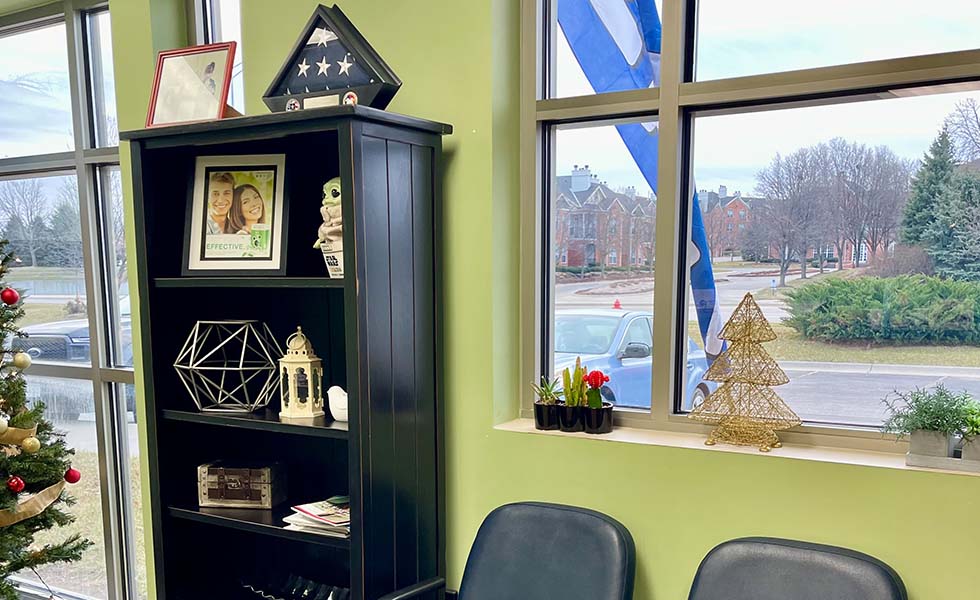 Decorations on bookshelf in dental office waiting room