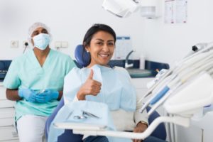 person smiling with white teeth at the dentist’s office